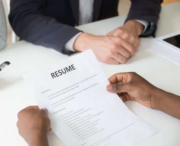 african-american-applicant-holding-resume-job-interview-close-up-view